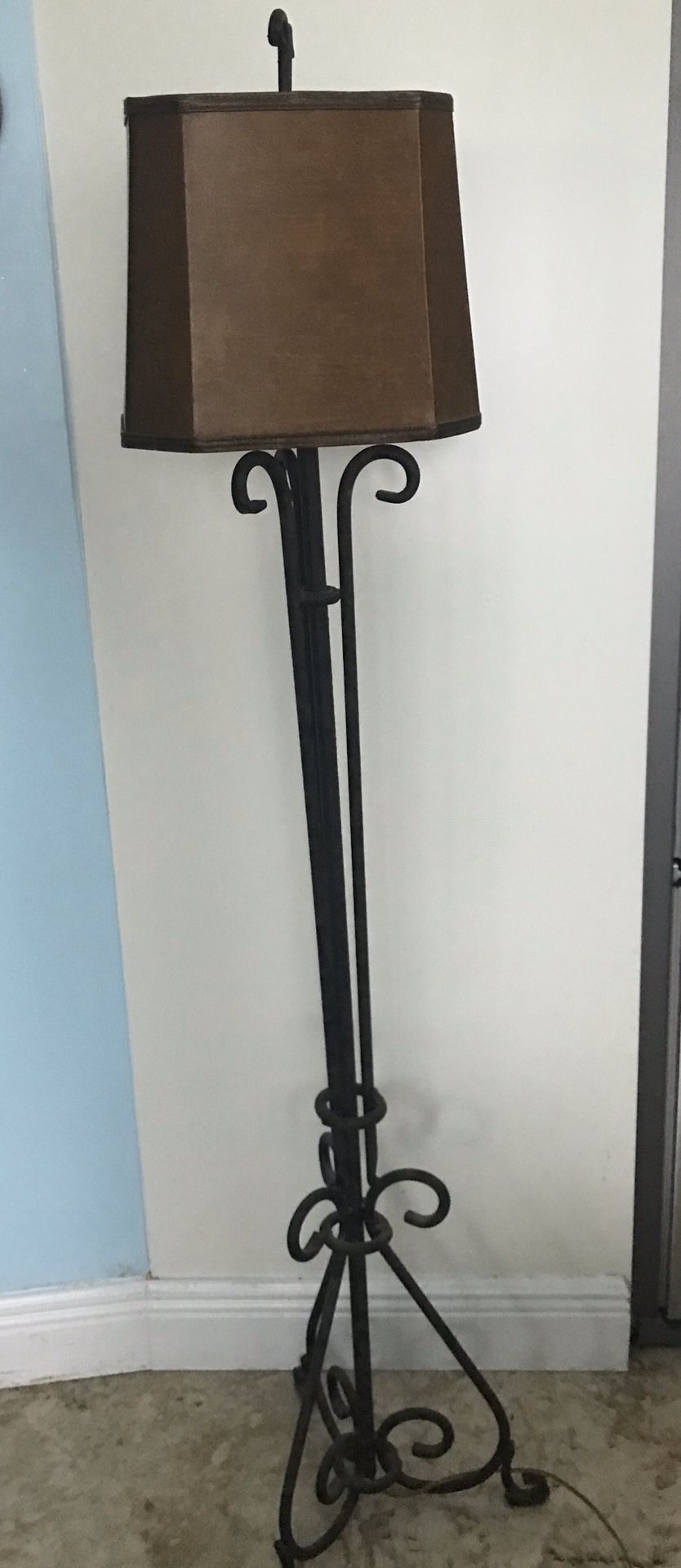 Wrought iron lamp with brown shade