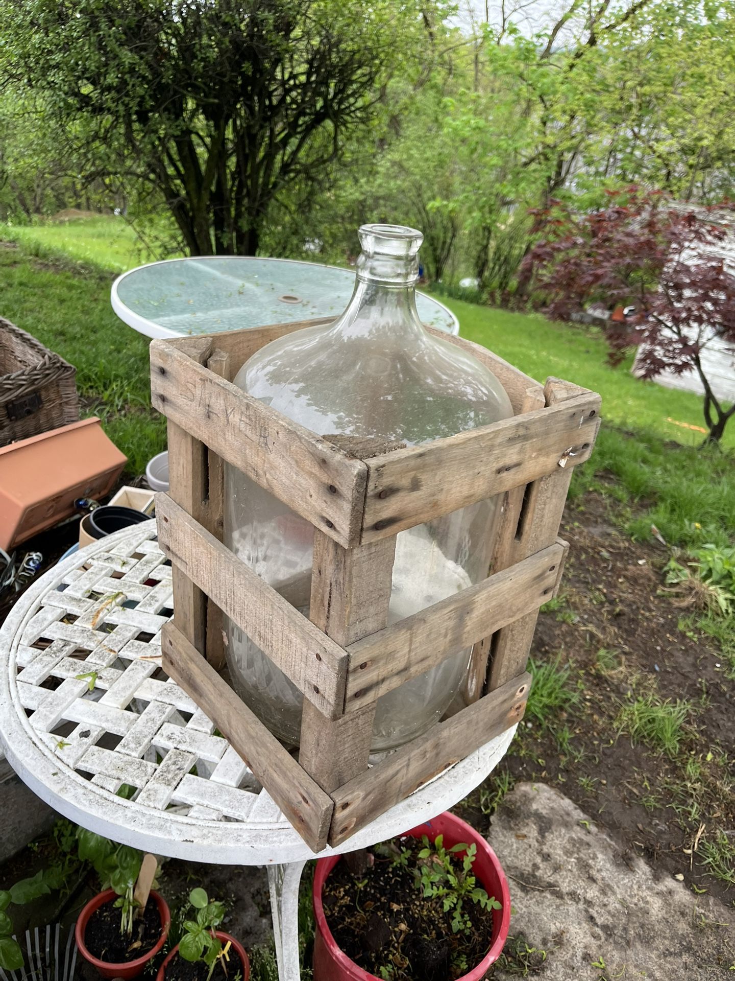 Decorative Gallon Jug In A Wooden Crate