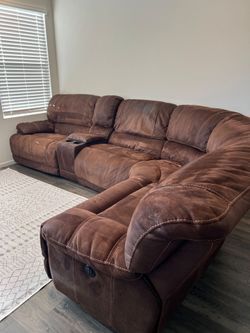5 piece sectional from a non smoking home with 3 Recliners and a storage console with 2 cup holders