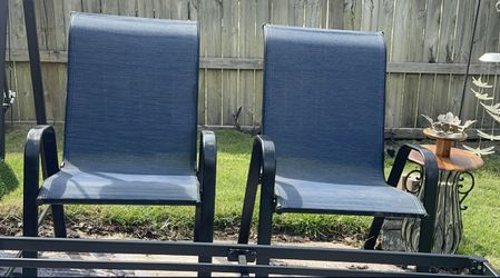 Brand new condition Sturdy outdoor Chairs . Has two comfy seats with blue fabric. Metal frame. Great for backyard or patio chillin.