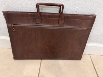 Two vintage leather portfolio carry cases (one features an embossed "GE" logo).good condition