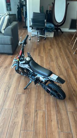 Minibike and can of fuel