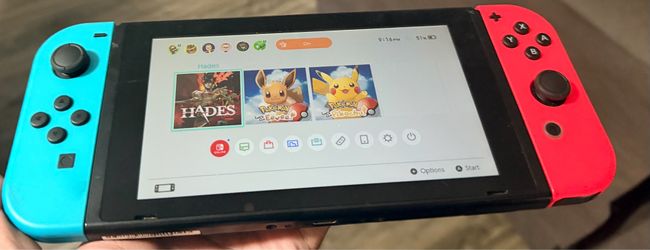 Nintendo switch w/ 3 digital games ( Pokémon’s & hades )