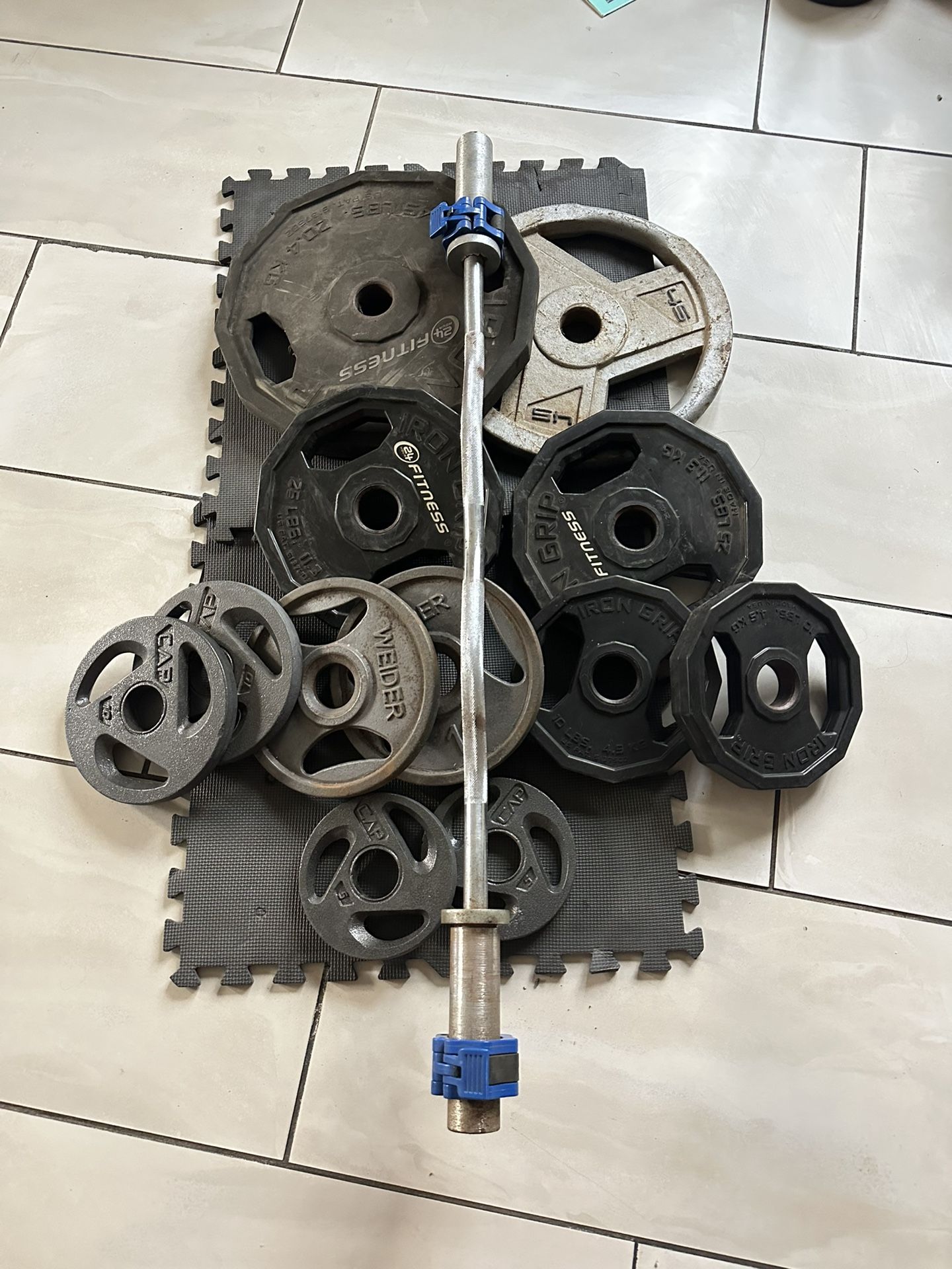 Olympic weights 210lbs total plus curl bar with clamps