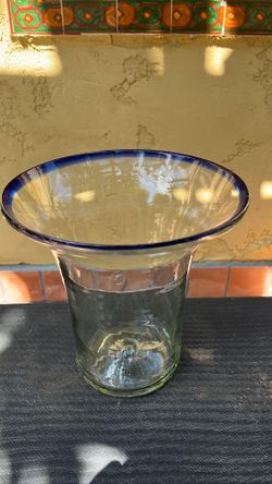Large blown glass vase with blue rim