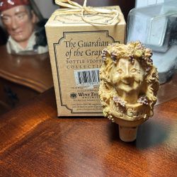 Guardian of the grapes bottle stopper