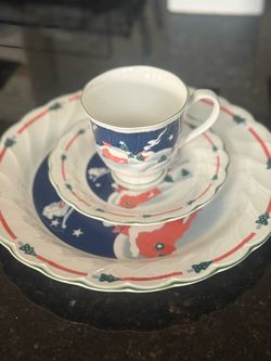 Christmas or New Year’s three-piece set: a cup with a saucer and a dinner (large dessert) plate.