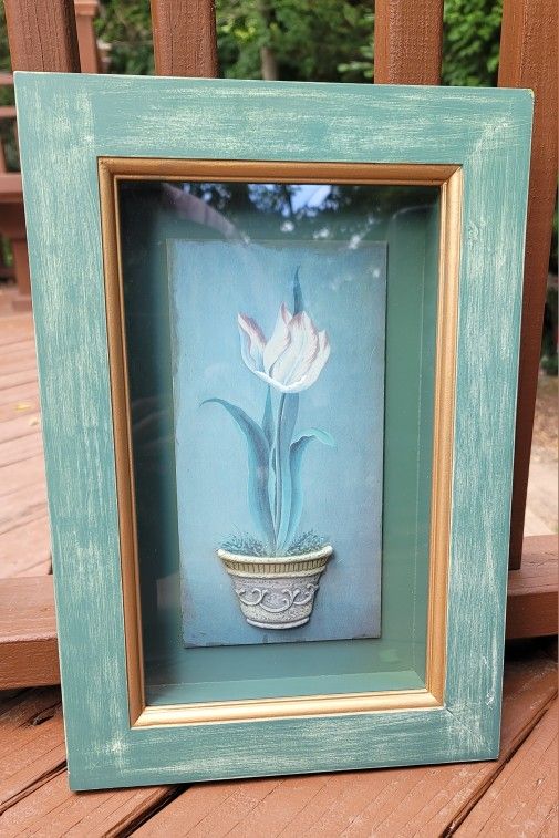 FLOWER IN A RAISED POT IN A 10"W×15"H SHADOW BOX GREEN FRAME