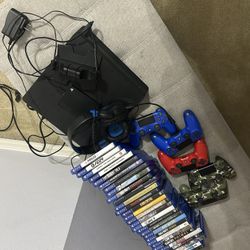 ps4 with charging station, 5 controllers, headphones, and 29 different games
