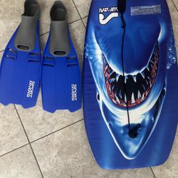 Blue bodyboard with shark design and matching fins.