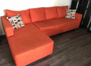 Custom orange L-shaped couch