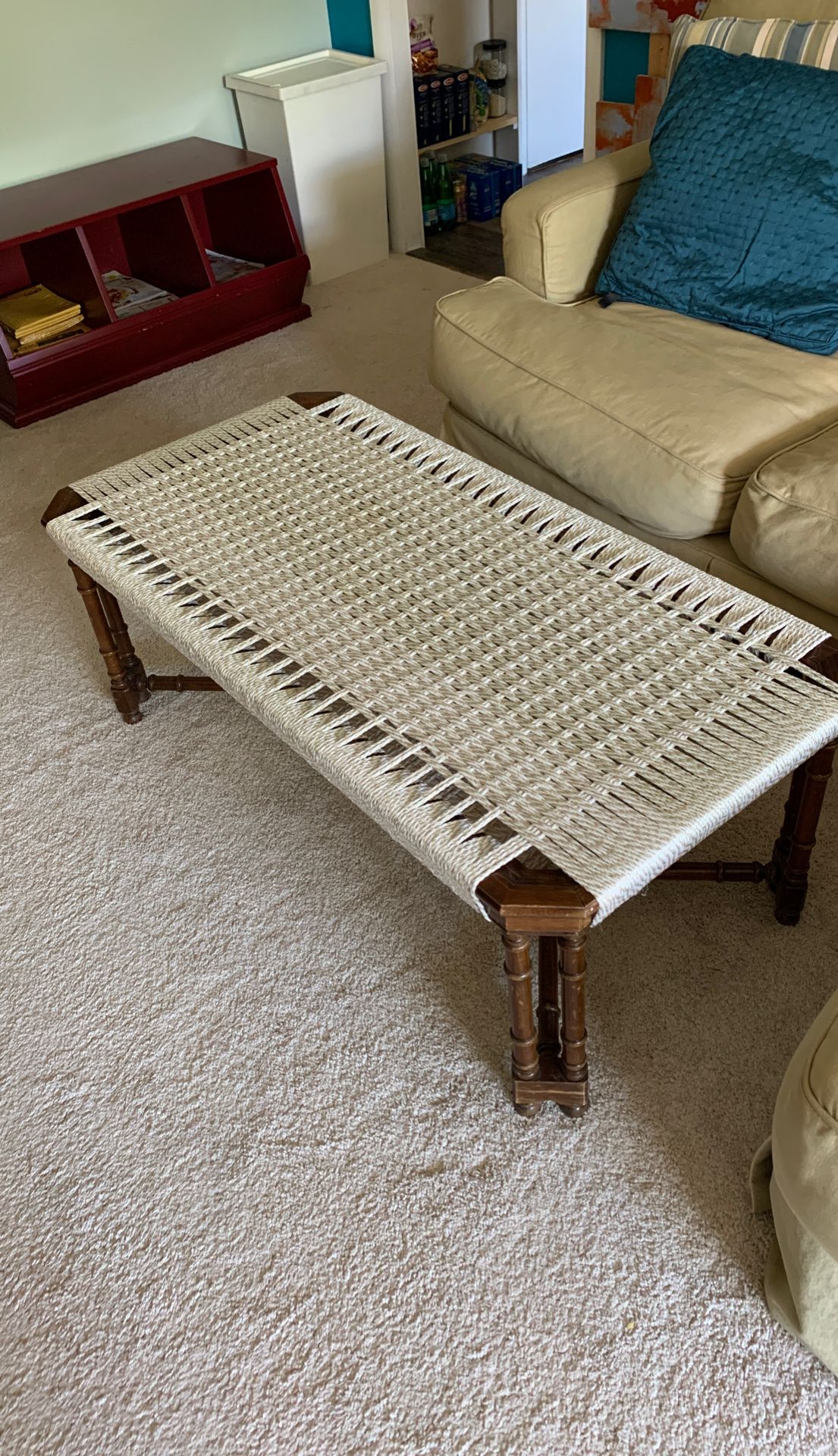 Coffee table with handwoven macrame top.