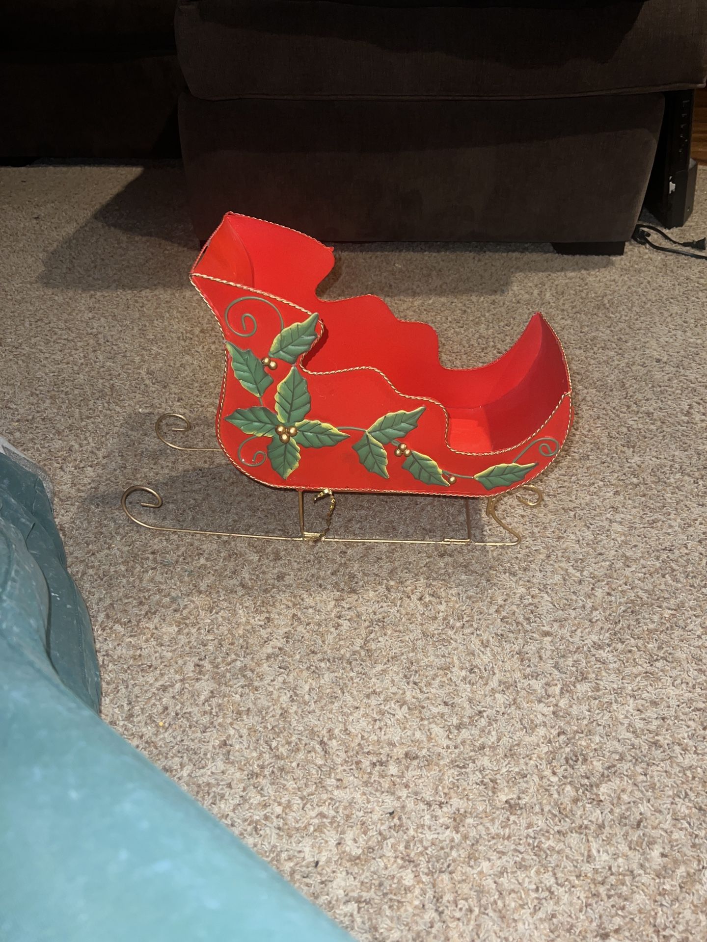 Festive Red Sleigh with Holly Accents. Has a dent in back paint is missing on side see pics 