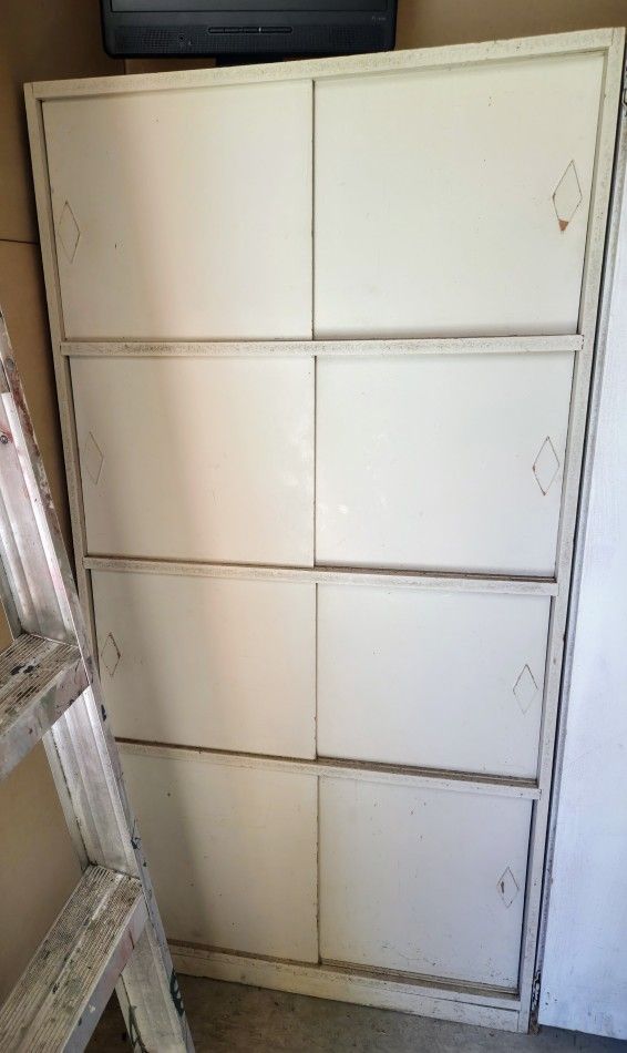 Free 5'x30" off White Cupboard With 4 shelves and closing Doors.