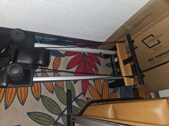 Pilates machine with attachments