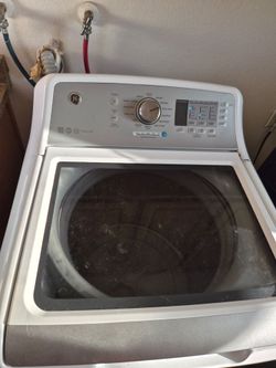 GE Top load washing machine  with detergent and softener dispensers  and GE Profile Gas dryer