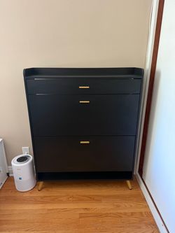 Black Dresser with Gold Handles and Legs