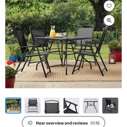 Glass table with 4 chairs and umbrella