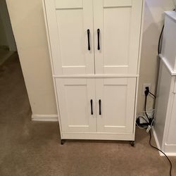 White wooden storage cabinet
