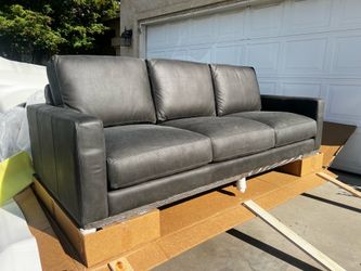 Brand New! Top Grain Leather Sofa. Charcoal color. $1200. Only 1 available.