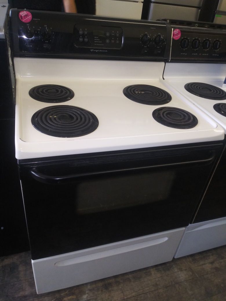 Frigidaire black and beige 4 burner coil electric stove