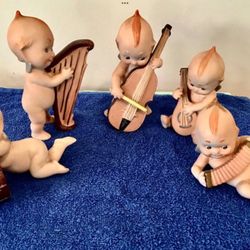 Early 1960s Set Of 5 Kewpie Musician Bisque Figurines Cello Drum Harp Etc. Players