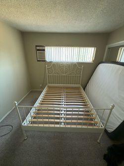 Queen Sized white metal bed frame with wooden slats included