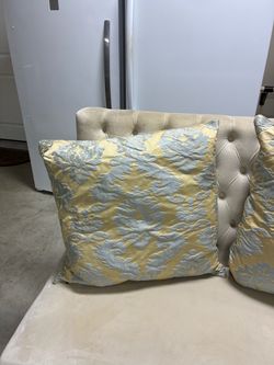 Large luxurious gold and slate blue pillows.