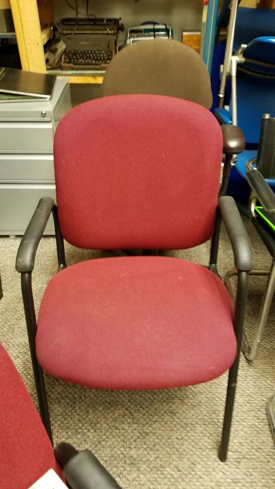 2 matching Globe office guest stacking arm chairs