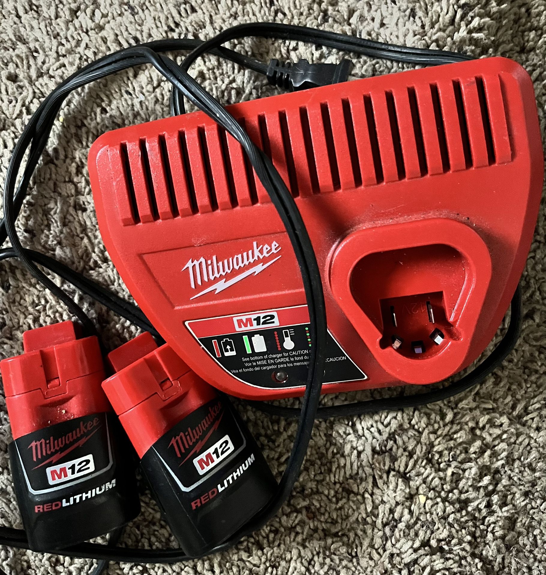 Milwaukee M12 Charger And Two Batteries