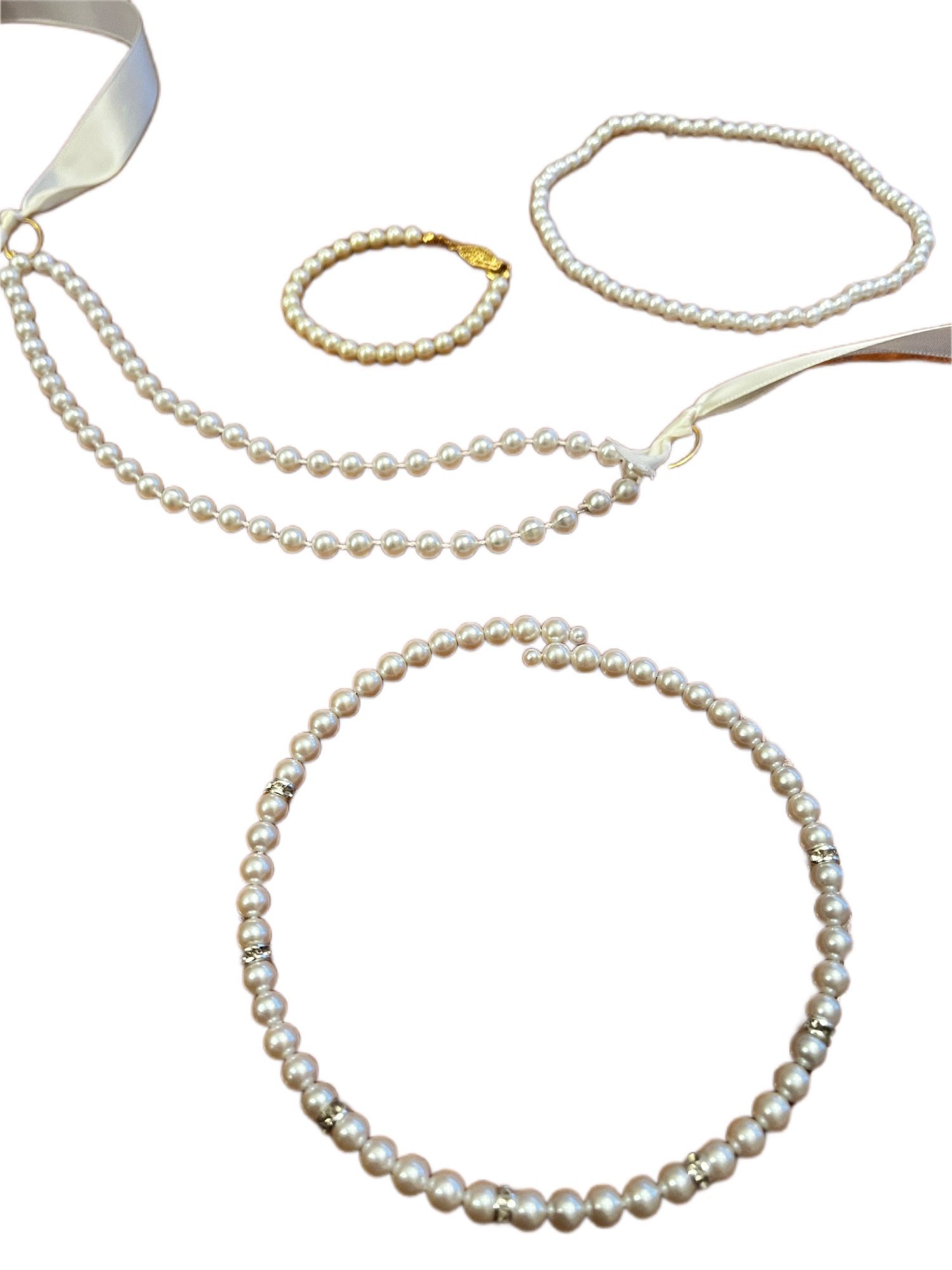 Set of 4, 3 girl’s necklaces and one bracelet. All faux pearl.