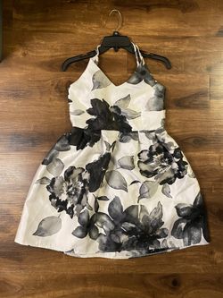 Brand New Woman’s Crystal Doll brand Black and White colored Floral Criss Cross Dress 