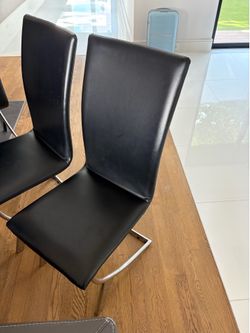 6 Black leather dining room chairs