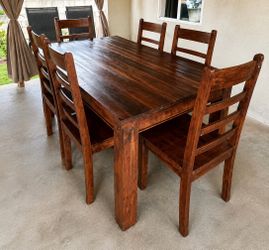Solid wood dining table located in Pomona