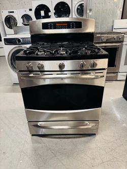 GE natural gas range with double oven, stainless steel; includes a receipt for a 60-day warranty.
