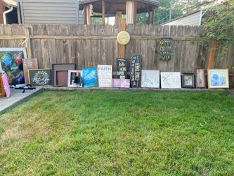 Lots of home decor wall signs and pictures