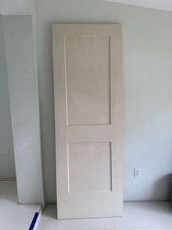 NEW Jeld-Wen Monroe 28x80 primed 2-panel slab door with pocket door frame