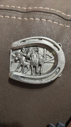Vintage steer wrestler belt buckle