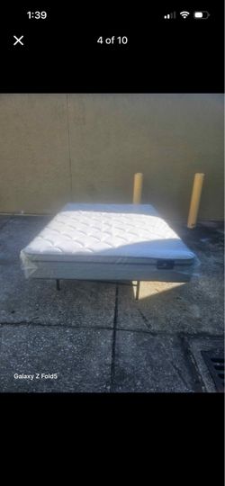 Brand new full-size plush Serta mattress in plastic