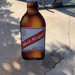 Red Stripe Bottle Tacked 24”x10”