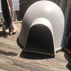 Large, fiberglass igloo, type dog house, color tan