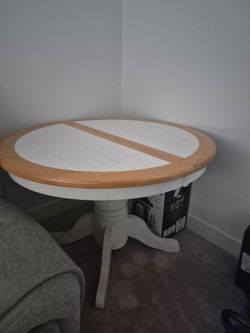 Table with 4 matching chairs(chairs not shown)