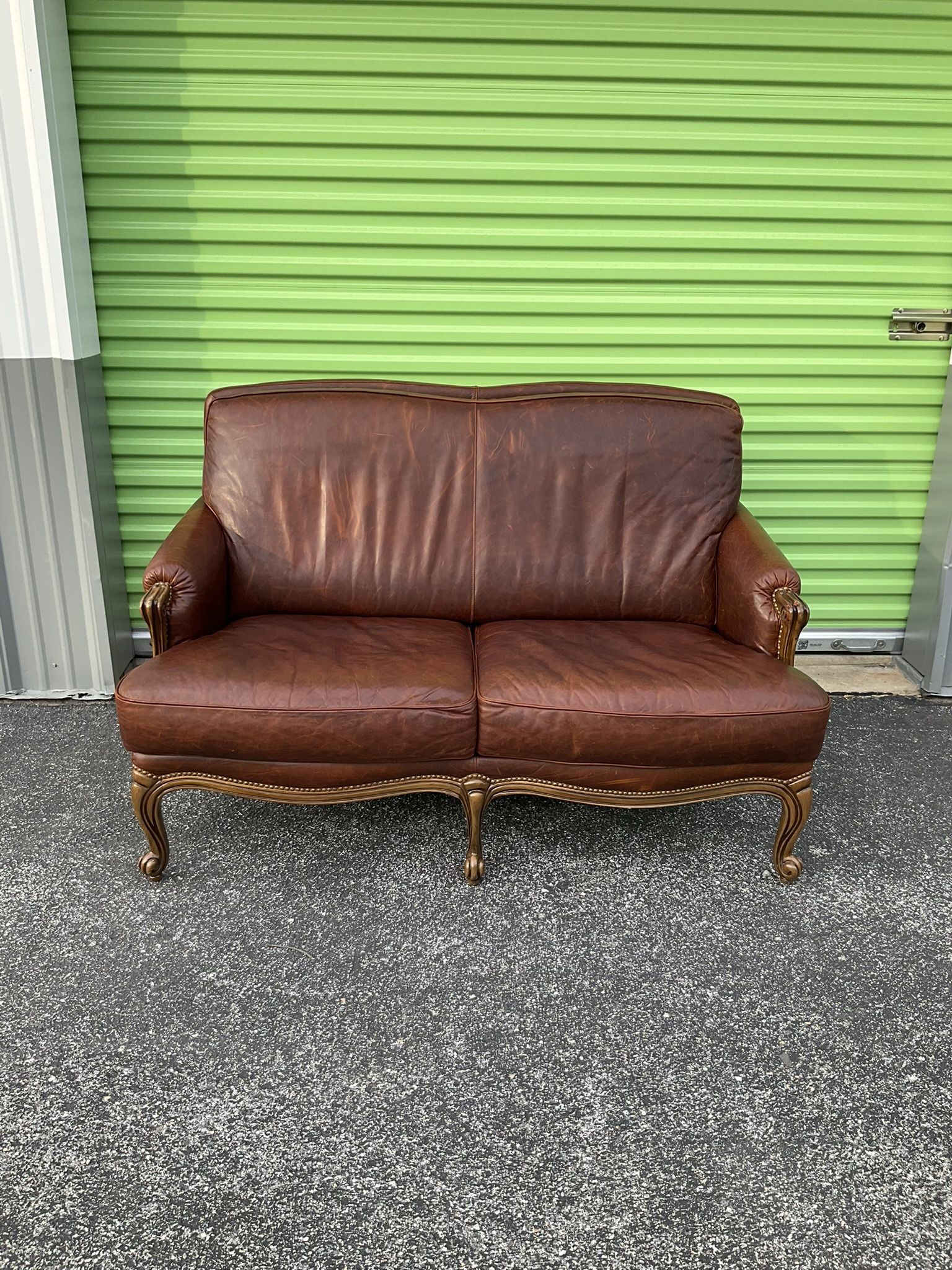 Vintage Genuine Leather Loveseat With Solid Wooden & Nailhead Trim