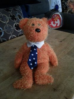 Orange plushi beanie baby bear