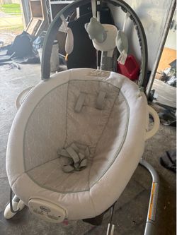 Vibrating baby swing