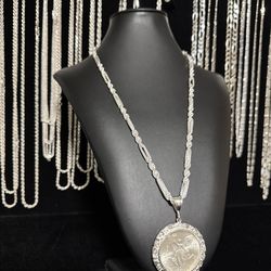 Italian silver diamond cut Milano chain with 1985 silver centenario and nugget bezel