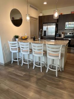 Four Matching Swivel Barstools