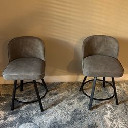 2 gray stool chairs