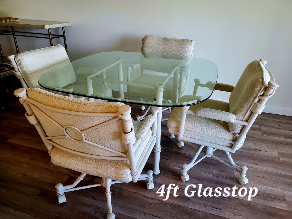 Table And 4 Rocking Roller Chairs