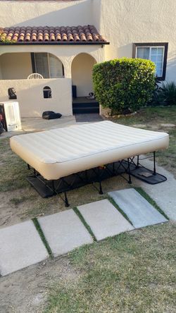 Beautiful inflatable queen size bed  regular high size bed  pump included 3 minutes to set up 3 minutes to fold it comes with storage travel luggage